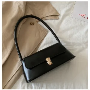 sac à main en cuir noir vintage avec fermoir doré – élégance rétro et minimaliste