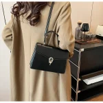 sac cuir noir avec poignée