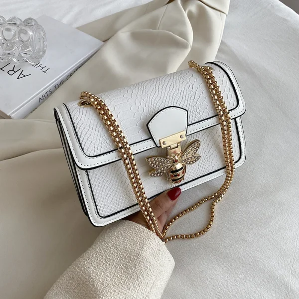 sac à main en cuir blanc effet python